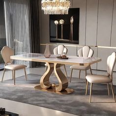 a dining room table with chairs and a chandelier