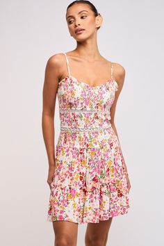 The Ayla Pink Floral Smocked Mini Dress is a floral dream! Smocked pink, white, and yellow floral print fabric forms this boho mini dress. Features a V-neckline, adjustable straps, crochet details, a fitted silhouette, and a flirty tiered ruffle hem. Style with dainty sandals for a semi-casual summer look! DETAILS & FIT Fitted Silhouette. Stretchy Smocked Fabric. 100% Rayon. Dry Clean For Best Results. Imported. New Preppy, Cami Mini Dress, Smocked Mini Dress, Boho Pink, Semi Casual, Tiered Mini Dress, Garden Dress, Floral Cami, Mini Cami Dress