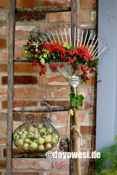 a bunch of fruit sitting on top of a wooden stand next to a brick wall