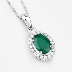 "14k Gold Emerald Pendant, Genuine Zambian Emerald Oval and Diamond 14k White Gold Pendant Necklace for Women, May Birthstone Gift for Her A luxe look for less! Sparkling with oval zambian emerald gemstone, this halo pendant necklace will have everyone fooled with its gorgeous gemstone lookalikes. Set in polished 14k white gold with fine finish with a total gemstone weight of 0.83 carats, this pendant necklace exudes a dreamy look. 14k gold emerald pendants are a perfect way to add a touch of co Formal Oval Pendant Necklace With May Birthstone, Oval Halo Setting Necklace For Formal Occasions, Oval White Gold Necklace, Oval Diamond For May Birthstone, Oval May Birthstone Jewelry With Polished Finish, Formal Oval Emerald Necklace In White Gold, Formal White Gold Oval Emerald Necklace, May Birthstone Oval Brilliant Cut Necklace, Silver Oval Emerald Necklace For Anniversary