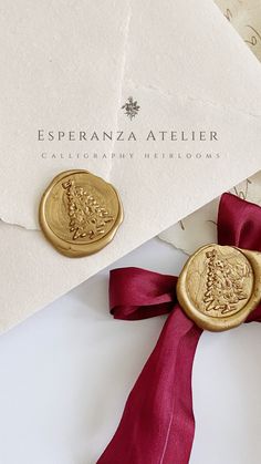 an envelope with wax stamp and red ribbon