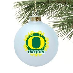 an ornament hanging from a christmas tree with the letter oregon on it's side