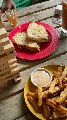 a plate with french fries and a sandwich on it