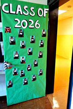 a green door with the words class of 2020 cut out on it and some magnets attached to it