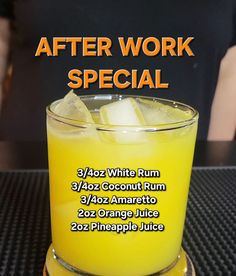 an orange juice is sitting on top of a table with the words after work special