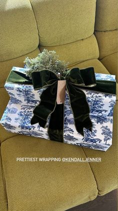 a wrapped present sitting on top of a couch