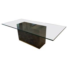 a glass and metal table on a white background with no one around it or someone else