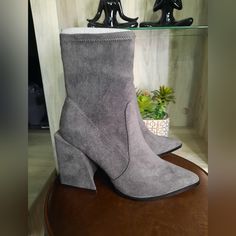 A Supple Suede-Like Finish And Stretch Shaft Lend Stylish Comfort To A Pointed-Toe Ankle Boot Lifted By A Wrapped Block Heel. 3.75" Heel 5.75" Shaft Pointed Toe Textile Upper And Lining, Rubber Sole Gray Ankle-high Spring Boots, Gray Ankle-high Boots For Spring, Gray High Heel Boots For Spring, Casual Gray Heels, Trendy Gray Pointed Toe Boots, Chic Gray Boots For Spring, Chic Gray Spring Boots, Gray Pointed Toe Boots For Spring, Spring Gray Pointed Toe Boots