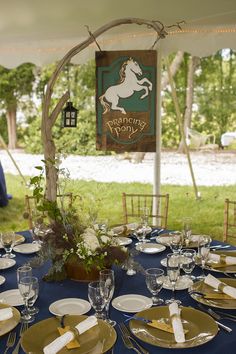 the table is set with plates and silverware