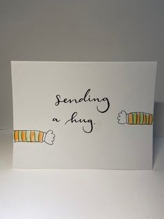 a greeting card that says sending a hug