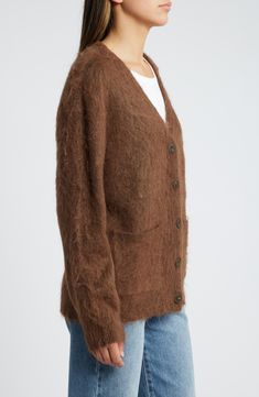 A fuzzy yarn hugs you with comfort in this cardigan knit in a classic, slightly oversized silhouette. Front button closure V-neck Long sleeves Ribbed cuffs and hem Front patch pockets 54% nylon, 24% polyester, 16% acrylic, 6% wool Hand wash, dry flat Imported Casual Mohair V-neck Outerwear, Classic Mohair Cardigan For Fall, Casual Mohair Outerwear With V-neck, Fall Mohair V-neck Outerwear, Classic Mohair Outerwear For Fall, Casual Mohair V-neck Cardigan, Mohair V-neck Outerwear For Fall, V-neck Mohair Outerwear For Fall, Oversized Casual Mohair Outerwear