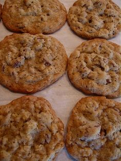 six cookies sitting on top of a baking sheet