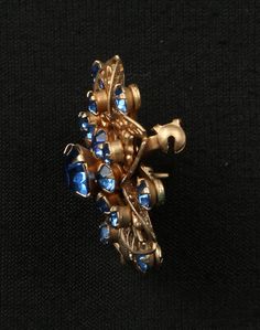 "Cobalt Floral Pin Gold Tone Filigree, Bright Blue Prong Set Rhinestone Floral Brooch, Excellent Condition, 1-3/8\" Diameter, Riveted Construction. Openwork Blue Rhinestones Flower Circle Brooch. This is a multi dimensional Art Deco Brooch full of beautiful detail and oh so sparkly. A great example of Mid Century Design. Clean and ready to wear or gift. c. 1950's Please read all descriptions and view all photos carefully. Please feel free to ask any questions that are not addressed on my policy Blue Costume Jewelry Brooch For Wedding, Blue Victorian Brooch For Formal Occasions, Victorian Blue Brooch For Formal Occasions, Blue Victorian Brooches For Formal Occasions, Art Deco Brooch, Dimensional Art, Flower Circle, Floral Pins, Multi Dimensional