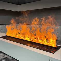 a fire burning inside of a fireplace with lots of orange and yellow flames on it