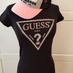 Brand: Guess Size: Xs Color: Black Shimmering Beads Adorn Our Iconic Logo In This Need-Now Knit Tee. Super-Stretch Knit Tee. Rounded Neckline. Short Sleeves. Beaded Triangle Logo At Front Made Of Cotton And Spandex Hand Wash **Only Guess Tee For Sale, Hat Is Not Included In The Listing** Casual Black Sequined T-shirt, Fitted Black T-shirt With Rhinestones, Fitted Casual Top With Rhinestones, Fitted Casual Tops With Rhinestones, Casual Fitted Tops With Rhinestones, Trendy Embellished Black Tops, Trendy Black Top With Rhinestones, Trendy Black Embellished Tops, Trendy Black Tops With Rhinestones