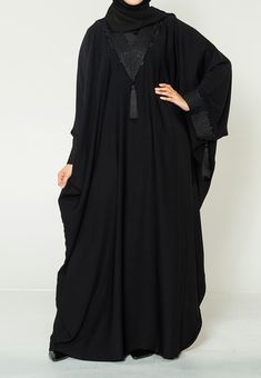 Hayah Al-Muslimah brings you a Palestinian inspired farasha. Traditional black on black embroidered lace on the neck line trailing along the cuffs with tassels. This abaya brings a touch of pure tradition, elegance and demure to your wardrobe. Includes matching hijab to keep you looking modest and traditional. Ready to dispatch Embroidered geometric lace on the neck and sleeves of the abaya Tassels on the sleeves and front. Black on Black minimal and elegant design Our best seller of all time. Hijab included Ideal for Ramadan, Umrah, Eid and any spiritual faith-led events Kaftan Abaya Dubai, Dubai Kaftan Dress, Farasha Abaya, Black Moroccan, Plus Size Kaftan, Ramadan Prayer, Black Kaftan, Dress Abaya, Black Minimal