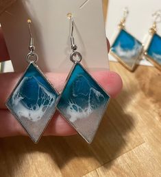 These coastal earrings are perfect for those beach vacations and summer months! They are made using real sand and sealed with resin for a durable finish.  Chose from your choice of gold, silver or bronze at checkout. Resin Jewelry For Summer Gifts, Summer Gift Jewelry Made Of Resin, Blue Resin Jewelry For Summer, Resin Earrings For Summer Beach, Nickel-free Silver Earrings For Vacation, White Resin Earrings For The Beach, Summer Gold Resin Earrings, Summer Beach Resin Earrings, Resin Drop Earrings For Beach