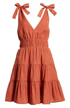 A tiered, ruffled skirt adds playful flounce to this smocked-waist minidress punctuated with ties at each shoulder. 35" length (size Medium) Slips on over head V-neck Side-seam pockets Lined 61% rayon, 27% polyester, 12% nylon Machine wash, line dry Imported Summer Pleated Tiered Dress, Mini Length Tiered Sundress With Ruffle Hem, Casual Mini Dress With Smocked Back And Tiered Skirt, Tiered Skirt Sundress With Ruffle Hem, Tiered Skirt Mini Dress With Ruffle Hem, Tiered Mini Dress With Ruffle Hem Sundress, Casual Tiered Mini Dress With Smocked Back, Tiered Mini Dress With Ruffle Hem For Vacation, Pleated Tiered Mini Dress