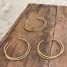 Hammered Brass with wonky, one of a kind shape. Measures about 2.5" in diameter *Each piece is hand-fabricated so there will be slight variations from the photographed item Handmade in Los Angeles Hammered Brass, Angeles, Cuff, Angel, Brass, Los Angeles