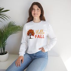 Hello Fall sweatshirt, Autumn gift Sweatshirt for women, fall gift sweatshirt for her, cute fall Crewneck Sweatshirt for her, birthday gift Ideal for any situation, a unisex heavy blend crewneck sweatshirt is pure comfort. These garments are made from polyester and cotton. This combination helps designs come out looking fresh and beautiful. The collar is ribbed knit, so it retains its shape even after washing. There are no itchy side seams on these sweaters.  .: Made with a medium-heavy fabric b Fall Crewneck Sweatshirt, Fall Crewneck, Autumn Gifts, Fall Gifts, Hello Fall, Fall Sweatshirt, Hello Autumn, Etsy Items, Gift For Women