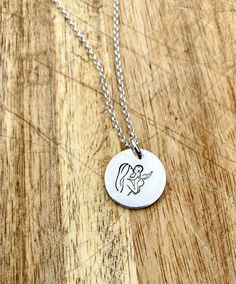 This beautiful necklace is a lovely memorial piece for all the babies, that we never got to hold, or only for a little while. Being a mother myself and having a baby loss I understand the impact this has on our lives. This little necklace is hand made and the image is hand stamped it can also be personalised with a name of date. It is simple and understated a little reminder to the wearer of the angel baby who is watching over them ❤️ It is made from 925 silver and comes on a Sterling silver 20 inch chain. Presented in a gift box with the background pictured  Please contact me if you would like to change the colour of the heart  All my items are sent via recorded delivery Baby Loss Memorial Gift, Angel Baby Crochet, Baby Loss Memorial, Infant Loss Memorial, Oak Leaf Necklace, Being A Mother, Baby Loss, Angel Baby, Infant Loss