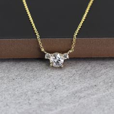 "14k White Sapphire Diamond Necklace | 5.0MM White Sapphire Pendant | White Sapphire Charm | April Birthstone Necklace | White Gold Necklace | Birthday Gift P R O D U C T 𝄪 D E T A I L S ✽ April Birthstone. ✽ Metal: 14k Yellow Gold, White Gold & Rose Gold ✽ Chain Length: 14\" - 20\" (Classic Rolo Chain) ✽ Center Stone: 5.0 mm Natural White Sapphire (approx. 0.5ct) ✽ Diamond Size: 2.0 mm x 2pcs (total 0.06ct) ✽ Diamond Color: G ✽ Diamond Clarity: VS-SI1 ✽ Made to Order O T H E R 𝄪 I N F O R M A Everyday Moissanite Jewelry With Brilliant Cut, Everyday Jewelry In Moissanite With Brilliant Cut, Minimalist Gold Moissanite Necklace, Gold Lab Grown Diamond Necklace For Wedding, Minimalist Yellow Gold Moissanite Jewelry, Minimalist Gold Moissanite Diamond Necklace, Dainty Gold Moissanite Necklace, Timeless Everyday Moissanite Jewelry, Everyday Moissanite Jewelry In Diamond White