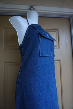 "Vintage 90s Tommy Jeans denim overall dress. Great vintage condition. measurements taken across front lying flat 16\" armpit to armpit waist 17\" at waistband 20\" hip 31\" length pit to bottm" Slim Fit Sleeveless Shortalls With Pockets, Fitted Sleeveless Shortalls With Pockets, Vintage Fitted Shortalls With Pockets, Fitted Denim Shortalls With Bib Front, Fitted Bib Front Shortalls With Pockets, Fitted Cotton Bib Front Shortalls, Vintage Fitted Shortalls For Spring, Vintage Fitted Pinafore Dress, Handmade Vest