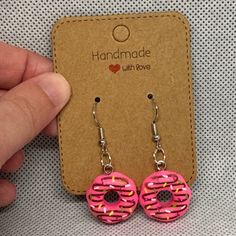 These Are Handmade By Me Birght Pink Donut Earrings. The Bright Pink Donut Is A Little Under An Inch High And A Little Under An Inch Wide. Please Refer To Photos For More Accurate Measurements And Sizing. The Earrings Are Made Out Of Hypoallergenic Iron And Resin. They Feature A Rubber Stopper On The Back. Please Refer To The Video To See All Of The Beautiful Details Of These Earrings. Earrings Contain Small Parts May Be A Choking Hazard. Polymer Clay Donut Earrings, Iron And Resin, Donut Earrings, Donuts Earrings, Pink Donut, Pink Donuts, Food Earrings, Hand Crafted Jewelry, Crafted Jewelry