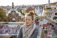 a woman sitting on top of a colorful bench