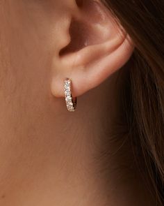 These round brilliant-cut Moissanite diamond hoop earrings are elegant and understated. Own these timeless Classic Diamond Hoops which are handcrafted in solid gold and micro prong set shimmering diamonds. Perfect for office or outing or simply to be worn regularly. These hoops are secured with hinged backs. Product Details Product Code: FE431 Width: 3 mm Diameter: 13.5mm mm Gross Weight(Approx.): 3.70 g Diamond Details Clarity: I-J-SI No. of Diamonds: 14 Metal Details Type: 14 Kt Gold Net Weigh Luxury Elegant Diamond White Hoop Earrings, Gold Hoop Earrings With Diamonds, Classic Rose Gold Diamond Hoop Earrings, 14k Gold Hoop Earrings With Brilliant Cut Diamonds, Classic Small Hoop Diamond Earrings With Single Diamond, Timeless Diamond Hoop Earrings With Single Diamond, Formal Cubic Zirconia Hoop Earrings With Single Diamond, Classic Single Diamond Huggie Earrings, Classic Round Huggie Earrings With Single Diamond