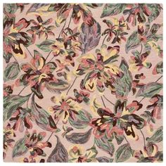 an area rug with colorful flowers and leaves on it's side, in pastel colors