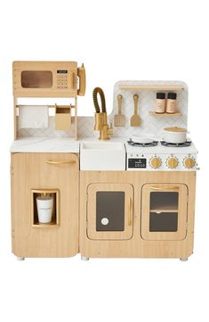 a wooden toy kitchen with an oven, stove and sink