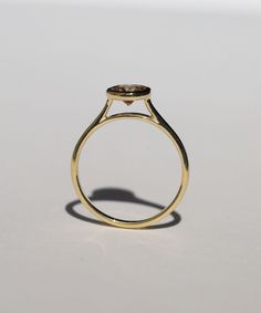 A Salt & Pepper Cognac diamond in a high bezel setting revealing the side profile of the ring. Specifications: Approx 1ct (1.18ct) round double cut salt and pepper diamond, in a high bezel setting, in 14k yellow Custom sized in approx. 10-14 days. Please contact us about rush orders. Minimalist Marquise Cut Bezel Set Jewelry, Formal Diamond Ring With Rose Cut Round Stone, Minimalist Marquise Cut Jewelry With Bezel Setting, Formal Rose Cut Diamond Ring With Round Stone, Formal Rose Cut Diamond Ring, Yellow Gold Diamond Ring With Bezel Setting, Marquise Cut, Yellow Gold Marquise Cut Diamond Ring With Bezel Setting, Modern Marquise-cut Diamond Ring With Bezel Setting, Modern Marquise Cut Diamond Ring With Bezel Setting