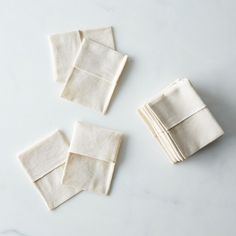 four pieces of cloth folded on top of each other