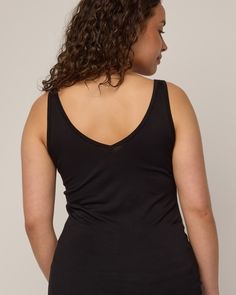 The women on our team can’t get enough of this tank. A layering piece that is comfortable, versatile, and has more length than other tanks you’re used to—made for tucking in or skimming the body for added coverage under other garments. Reversible front to back, allowing for either a scoop neck or v-neck option. Flatlock seams and just-right 1” width straps make it your most functional, everyday tank top. We recently updated this style (November 2023) to be a true slim layering tank. Chest, waist Black Tank Top With Built-in Bra For Loungewear, Versatile Tank Top With Built-in Bra For Loungewear, Versatile Tops With Built-in Bra And Scoop Neck, Sporty Black Cami Top, Versatile Bra Friendly Camisole Top, Black Scoop Neck Tank Top For Loungewear, Versatile Yoga Tops With Tank Straps, Versatile Seamless Cami Top, Black Stretch Modal Tank Top