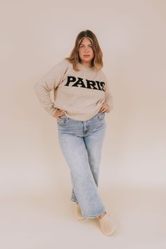 Stay cozy and stylish with this Take Me To Paris Sweater. Crafted in an oatmeal heather, this relaxed fit sweater is complete with "PARIS" lettering across the front in bold black. So whether it's a romantic getaway or a stay-cation, you'll always be dreaming of the City of Lights! Details Relaxed fit Oatmeal heathered knit Black "Paris" lettering Round neckline Soft! Ribbed neckline, hemline, and cuffs Sizing Approximate measurements: SIZE LENGTH BUST 1XL/2XL 28” 54” 2XL/3XL 29” 56” Fabric has Nursing Friendly Tops, Plus Swim, Nursing Friendly Dress, Plus Jumpsuit, Exclusive Dress, Basic Dress, Maternity Shops, Plus Dresses, Fitted Sweater