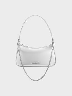 This simple bag is instantly transformed into a statement piece, thanks to its striking metallic silver finish. The classic silhouette is complete with subtle rounded corners and a minimalist design that makes this a piece that will transcend seasons and trends. It comes with silver-toned hardware for a complementary silver-on-silver colourway. With ample space to hold your most-used essentials, this little bag is the perfect party companion. Prom Bag, Simple Bag, Silver Bag, Silver Bags, Size Chart For Kids, Metallic Bag, Charts For Kids, Charles Keith, Simple Bags