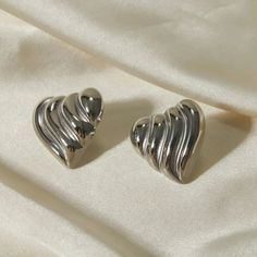 Stainless Steel Heart Shape Stud Earrings Celebrate timeless elegance and heartfelt sentiments with our Stainless Steel Heart Shape Stud Earrings. These stunning earrings are the perfect blend of sophistication and charm, making them an essential addition to any jewelry collection. Key Features: Material: Crafted from high-quality stainless steel, these earrings are designed to be durable and long-lasting. They are also available in exquisite 18K gold-plated and silver-plated finishes for a touc Elegant Heart-shaped Clip-on Earrings For Valentine's Day, Silver Double Heart Classic Earrings, Silver Classic Double Heart Earrings, Metal Heart Pendant Earrings For Anniversary, Classic Silver Double Heart Earrings, Elegant Metal Earrings With Heart Charm, Elegant Metal Heart Shaped Clip-on Earrings, Elegant Metal Heart-shaped Clip-on Earrings, Elegant Heart-shaped Metal Clip-on Earrings