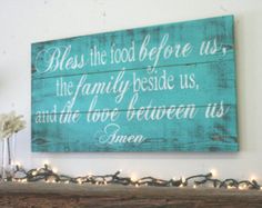 a wooden sign that says, blessing the food before us is the family beside us and the love between us