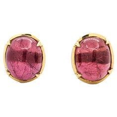 15.5ctw Cabochon Pink Tourmaline Earrings In Yellow Gold These captivating earrings are masterfully crafted from 18kt yellow gold, featuring an impressive 15.5ctw of cabochon pink tourmaline. These luscious pink tourmalines stand out with their remarkable clarity and vibrant color, making the earrings a statement piece. Measuring 14.8x11.14mm, they have a total weight of 7.28 grams, striking a perfect balance between elegance and boldness. The natural beauty of the pink tourmaline, set in rich y Color Making, Tourmaline Earrings, Belleza Natural, Pink Tourmaline, Jewelry Earrings Studs, The Pink, Oval Shape, Statement Pieces, Tourmaline