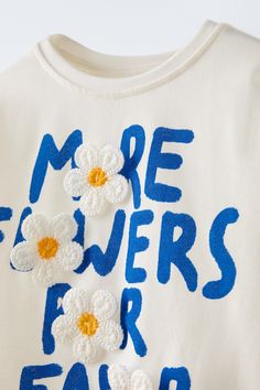 FLORAL PRINT TOP T-shirt Floral, Zara Summer T-shirt With Text Print, Trendy Blue T-shirt With Embroidered Graphics, Trendy White Zara T-shirt, Summer Short Sleeve T-shirt With Embroidered Text, White Embroidered Graphic Tee, Trendy Summer T-shirt With Embroidered Text, Trendy T-shirt With Embroidered Text For Summer, Blue T-shirt With Embroidered Text For Spring