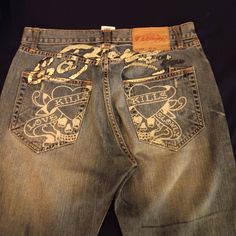 Ed Hardy Jeans 100% Cotton Love Kills Faded Front And Back. Few Ink Spots On Front. Has Rugged Feel And Look. Odd Clothes, Evisu Pants, Ed Hardy 2000s, Twink Fashion, Ed Hardy Clothes, 2000s Mens Fashion, Pants Painting, Dragon Jeans, Jean Brands