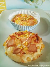 two muffins sitting on top of a white plate next to a cupcake tin