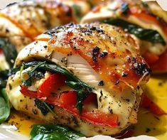 chicken with spinach and tomatoes on a plate