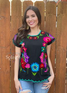 This Beautiful Mexican blouse is full of colorful flowers in both the front and the sleeves that are inspired by Mexican culture. This blouse is embroidered By Mexican Artisans in Chiapas and is completely one of a kind. Purchase the gold plated filigree earrings here: https://www.etsy.com/es/listing/869865239/filigrana-de-corazon-filigrana-clasica?ref=listings_manager_grid Multicolor Summer Blouse For Fiesta, Spring Festival Multicolor Blouse, Folk Style Floral Print Tops For Festivals, Multicolor Bohemian Tops For Fiesta, Folk Style Blouse With Floral Print And Short Sleeves, Multicolor Bohemian Blouse For Fiesta, Bohemian Multicolor Blouse For Fiesta, Multicolor Tops For Cinco De Mayo Fiesta, Traditional Floral Print Blouse For Festival