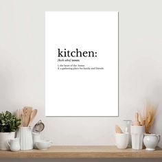 a kitchen poster with the words kitchen written in black and white on top of it