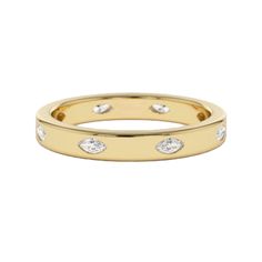 a yellow gold ring with three diamonds