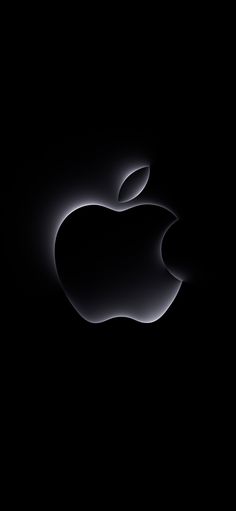 an apple logo is shown in the dark