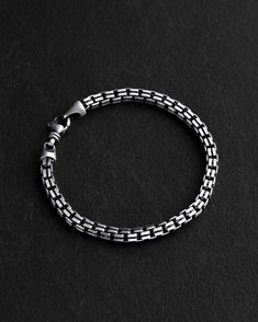 Introducing the Silver WEG Bracelet, a meaningful piece that encapsulates the essence of the German word "weg," symbolizing each individual's life journey and pursuit of self-discovery and destiny. This elegant accessory embodies the concept of both physical and spiritual exploration, offering the wearer a reflective reminder of their path, choices, and personal growth direction. The sleek design and simplicity of form make this bracelet a versatile addition that complements any outfit, serving Silver Minimalist Bracelet With Box Chain, Minimalist Silver Box Chain Bracelet, Sterling Silver Box Chain Bangle Bracelet, Sterling Silver Box Chain Bangle, Sterling Silver Bracelets With Rectangular Links Box Chain, Sterling Silver Link Bracelets With Stainless Steel Clasp, Minimalist Sterling Silver Round Box Chain Bracelet, Sterling Silver Link Bracelet With Stainless Steel Clasp, Sterling Silver Bracelet With Stainless Steel Clasp For Gift