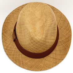 Grade: FineMaterial: 100% Natural Toquilla StrawColor: Beige (Natural straw)Brim width (approx.): 4.5 cm / 1.8 inchSizes available: 56 cm to 62 cm You'll look gorgeous at any time wearing the Best hat of the world, the Panama Hat! - Worldwide, all Panama Hats are handwoven with Toquilla Straw Fiber in the city of Montecristi, located in Ecuador - South America. Panama hat is a traditional brimmed hat of Ecuadorian origin that is made from the plaited leaves of the “Paja Toquilla” straw plant. St Isthmus Of Panama, Trilby Fedora, Brimmed Hat, Straw Hat, Hat Sizes, Ecuador, South America, Panama Hat, Panama